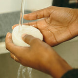Woman washing hands with refugee made soap